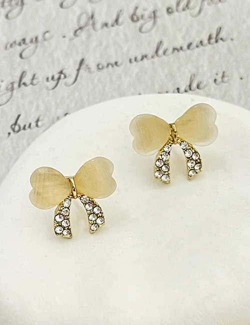 Fashion Gold Alloy Diamond Resin Bow Stud Earrings